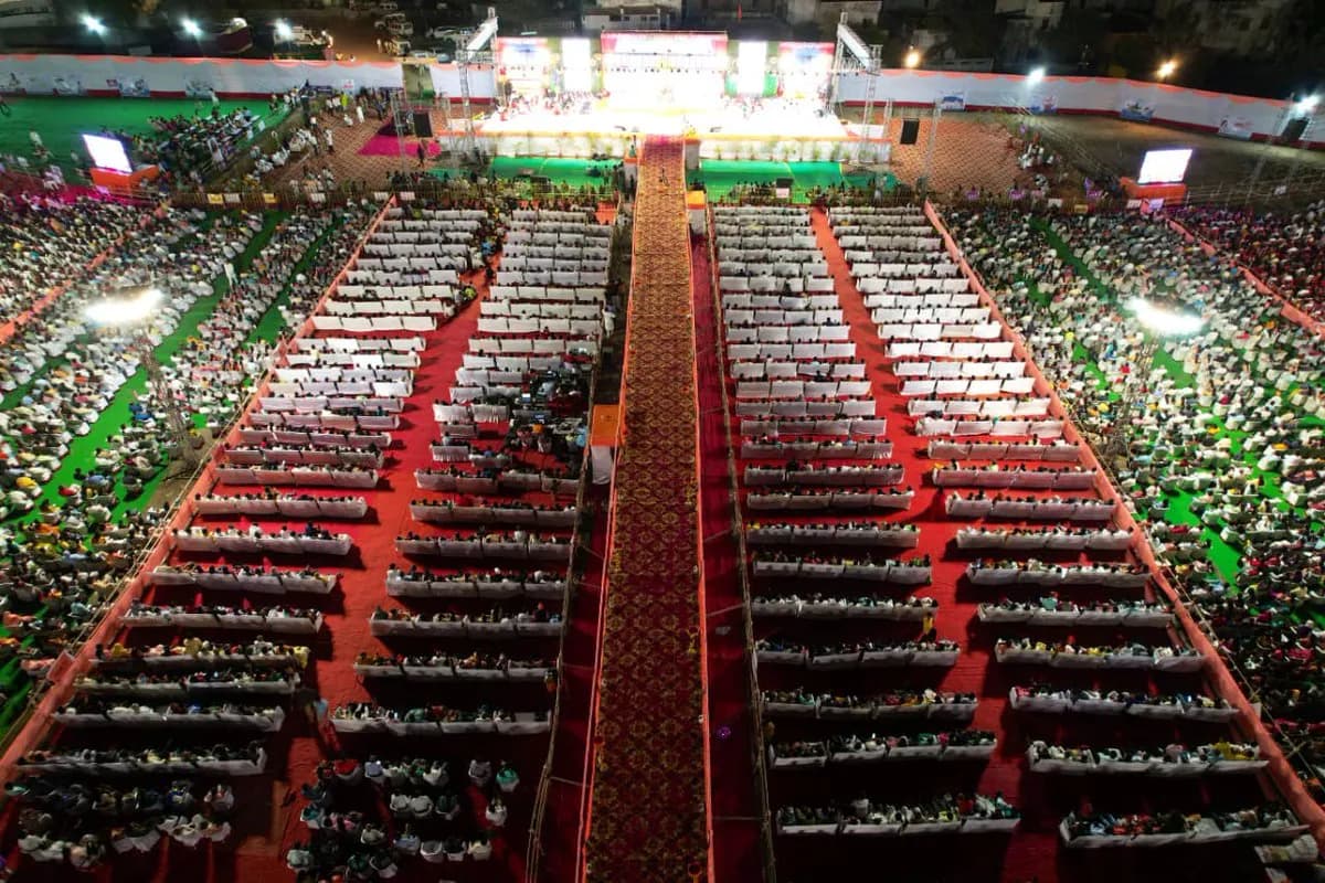 Row after row of seated participants across an immense covered gathering.