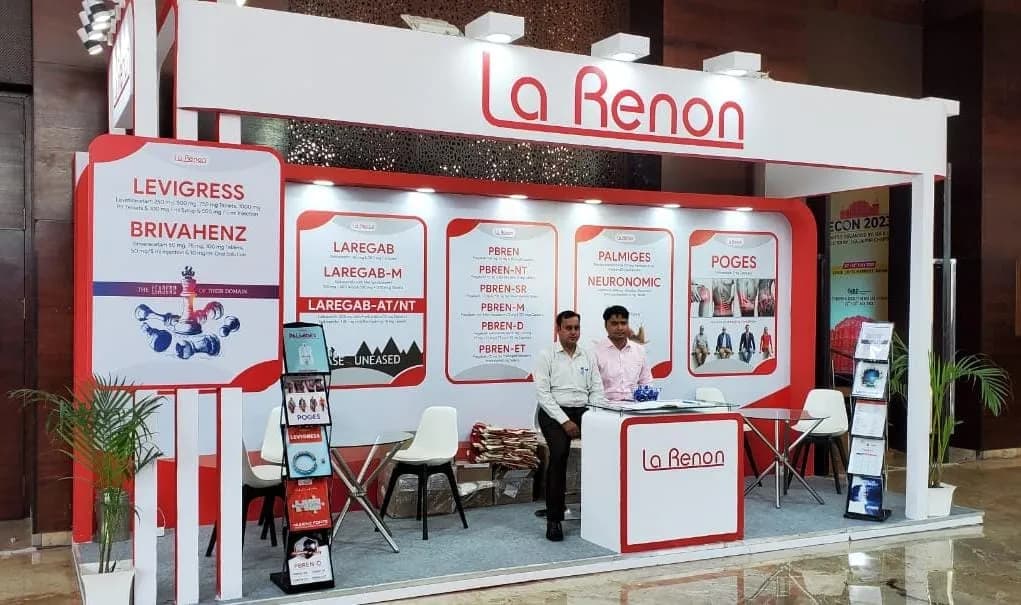 A fabricated exhibition stall shell with printed panels and seating.