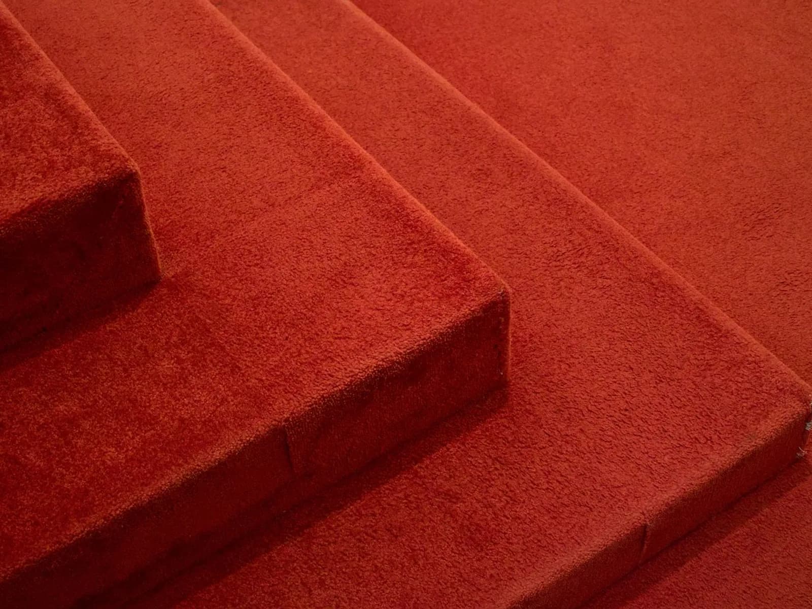 Carpet laid over levelled platform steps.