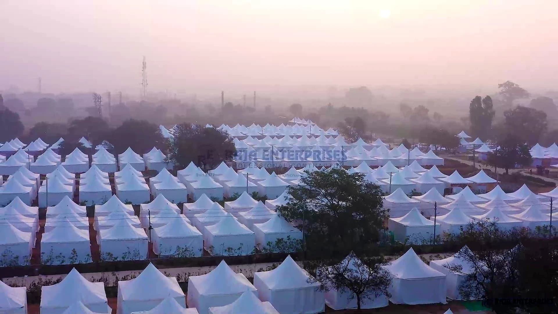 Aerial view of high-capacity event complex and temporary infrastructure.